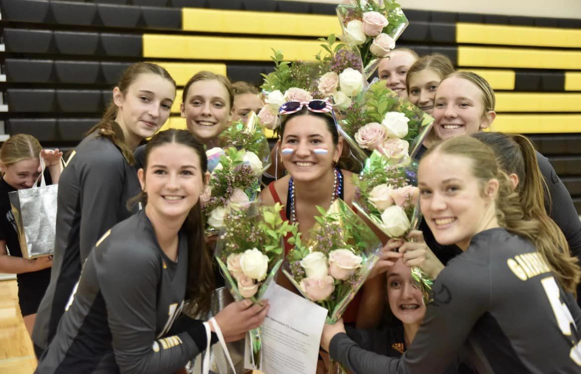 Claire created bouquets for the volleyball seniors.