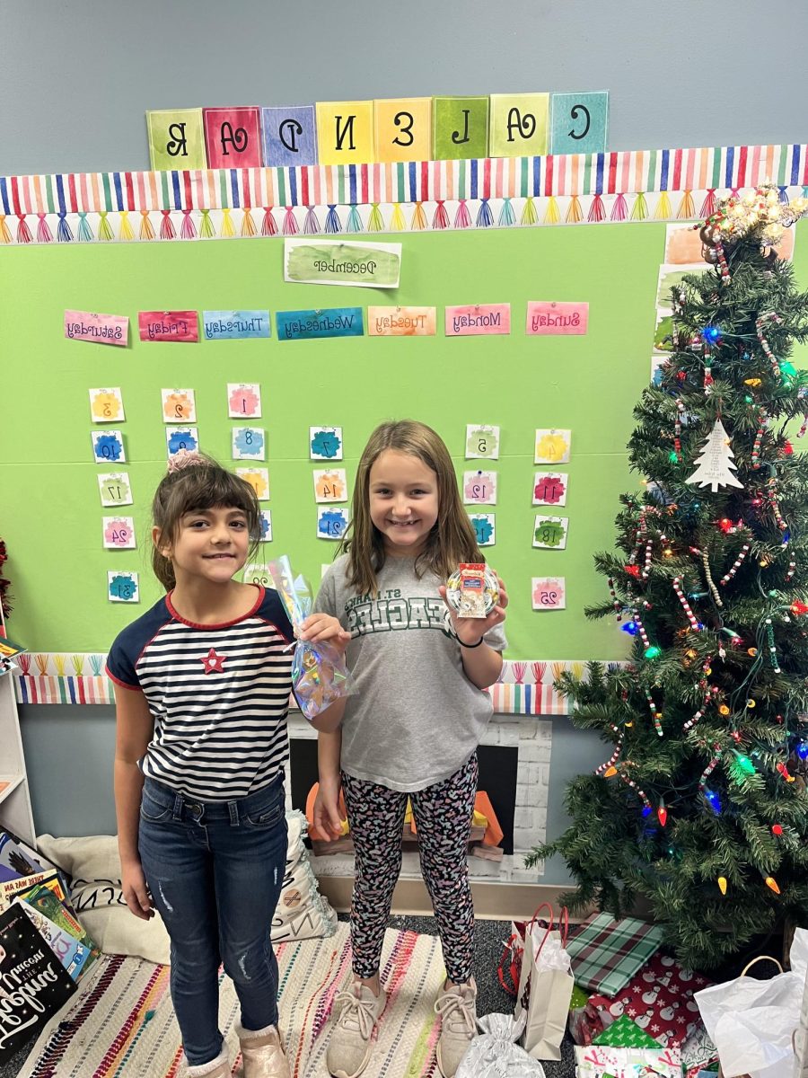 The kids proudly show their finished project.