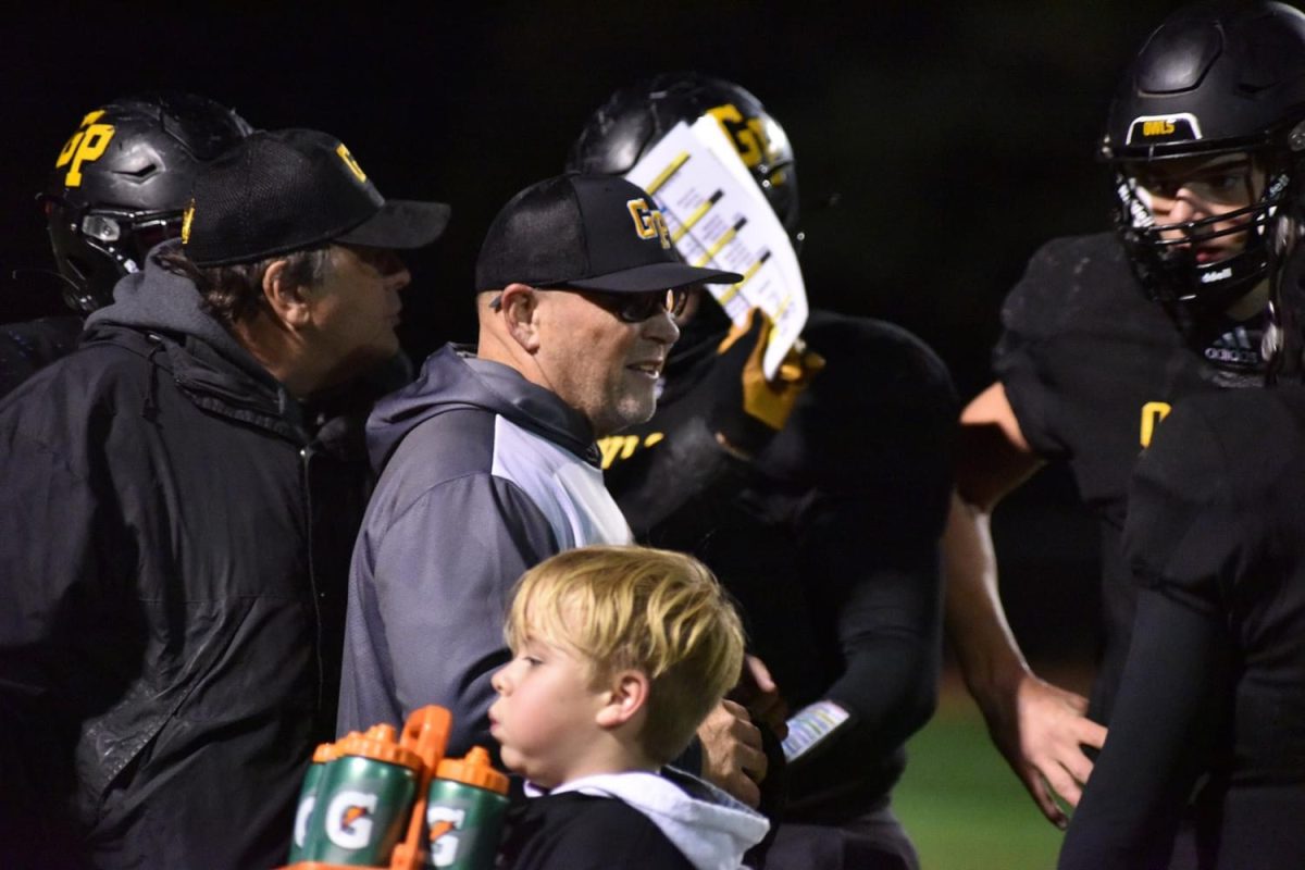 Coach Rice coaching the football team.