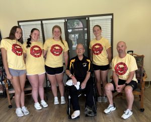 GP Student Council members visited custodian Doug Knoblauch to deliver a community donation for his health care expenses.