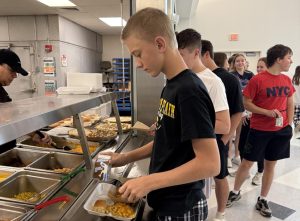 Students line up to check out the daily options offered by new food service provider, Chartwells.